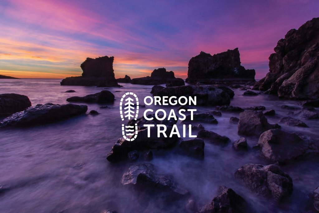 Sunset along a rocky Oregon coastline with purple and orange sky, waves washing over tidepools, and white "Oregon Coast Trail" logo centered.